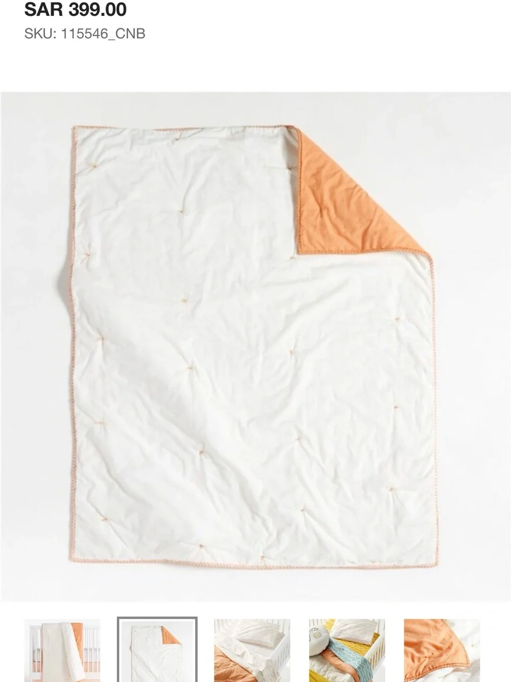 Crate and Barrel, Crate and Kids mini tufted crib quilt. Peach color